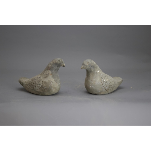 281 - AN UNUSUAL PAIR OF POTTERY DOVES, HAN DYNASTY, BC 206 - AD 220
The grey ware hand modelled, and with... 