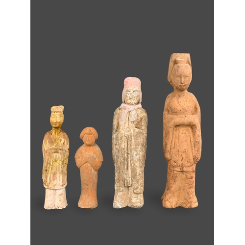 293 - A GROUP OF FOUR POTTERY FIGURES, 4TH/5TH CENTURY
Including three figures of officials, one of them s... 