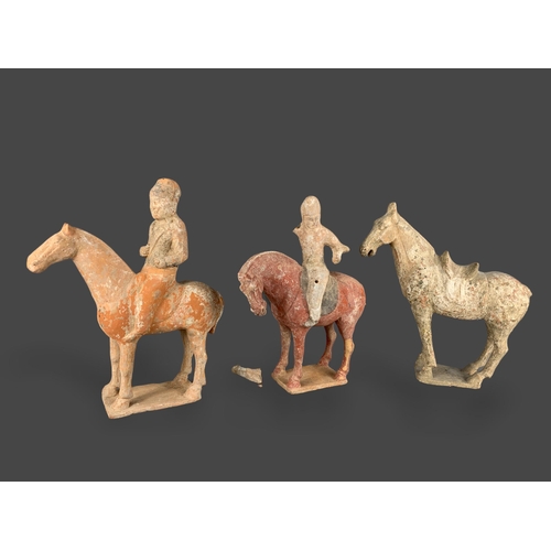 295 - TWO POTTERY EQUESTRIAN GROUPS, AND A SADDLLED HORSE, TANG DYNASTY (AD 618 - 907)
The first equestria... 