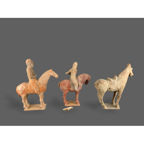 295 - TWO POTTERY EQUESTRIAN GROUPS, AND A SADDLLED HORSE, TANG DYNASTY (AD 618 - 907)
The first equestria... 