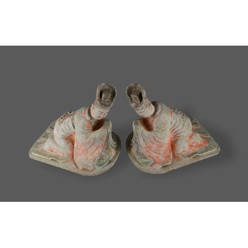 297 - A large pair of pottery Figures of kneeling Courtiers, Tang dynasty, AD 618 - 907

L: 38cm

PROPERTY... 