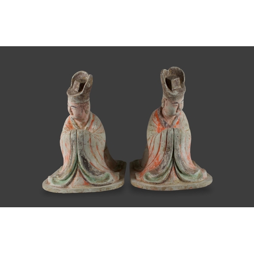 297 - A large pair of pottery Figures of kneeling Courtiers, Tang dynasty, AD 618 - 907

L: 38cm

PROPERTY... 