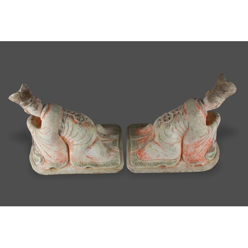 297 - A large pair of pottery Figures of kneeling Courtiers, Tang dynasty, AD 618 - 907

L: 38cm

PROPERTY... 