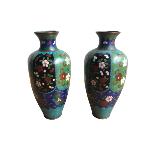 121 - A PAIR OF CHINESE CLOISONNÉ ENAMEL 
Vases having floral decoration. 
(18.3cm)