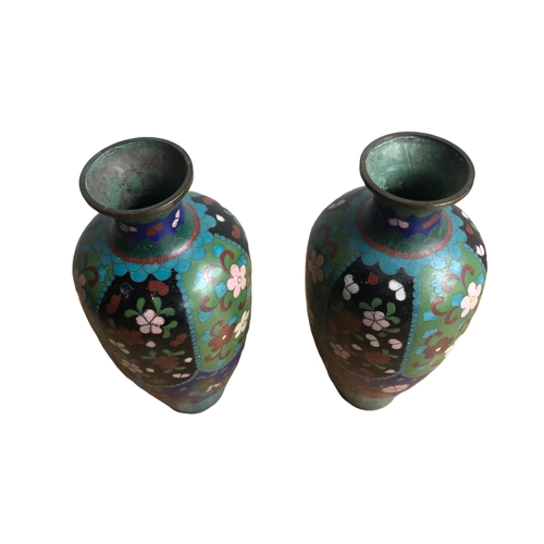 121 - A PAIR OF CHINESE CLOISONNÉ ENAMEL 
Vases having floral decoration. 
(18.3cm)