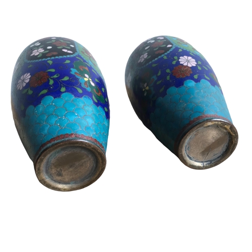 121 - A PAIR OF CHINESE CLOISONNÉ ENAMEL 
Vases having floral decoration. 
(18.3cm)