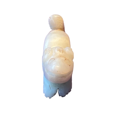 257 - A CHINESE QING DYNASTY (OR LATER) WHITE JADE CARVING OF A DOG
White ‘mutton fat’ colour, in a crouch... 