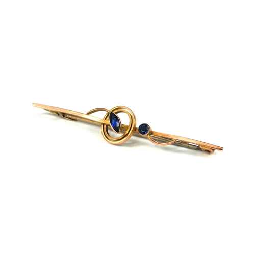 23a - AN ART DECO 9CT GOLD AND SAPPHIRE BAR BROOCH IN CASE.
(1.6g, Height 10mm x Width 50mm x Depth 10mm)