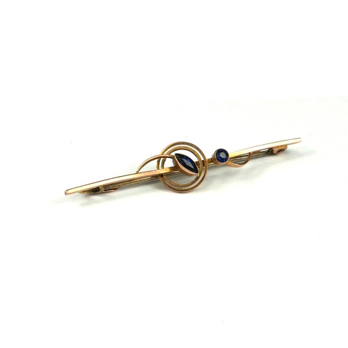 23a - AN ART DECO 9CT GOLD AND SAPPHIRE BAR BROOCH IN CASE.
(1.6g, Height 10mm x Width 50mm x Depth 10mm)