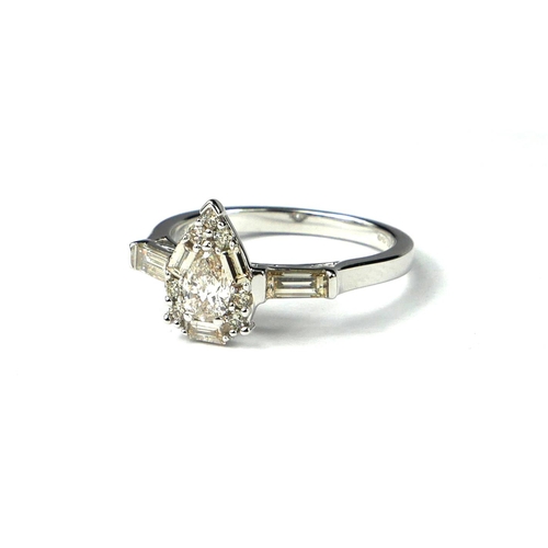 38 - A PEAR SHAPED, BAGUETTE AND ROUND BRILLIANT CUT DIAMOND CLUSTER RING
Set in a 9ct white gold.  
(dia... 