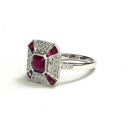 42 - AN ART DECO STYLE 18CT WHITE GOLD, RUBY AND DIAMOND RING
Flanked by diamond shoulders.  
(approx rub... 