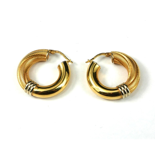55 - A PAIR OF 18CT YELLOW GOLD HOOP EARRINGS
Having fine textured and plain design, marked ‘18ct’ to bot... 