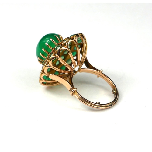 9 - A LARGE 14CT GOLD CABOCHON EMERALD COCKTAIL RING
Surrounded by a graduated emerald double halo setti... 