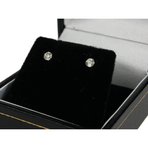 95A - A PAIR OF 18CT WHITE GOLD SOLITAIRE DIAMOND STUDS, Boxed.  (0.20ct)