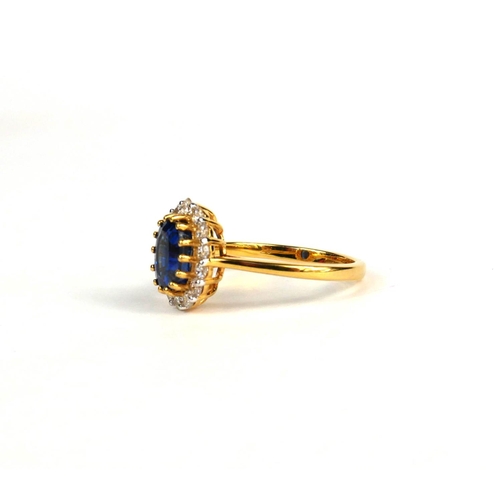 98A - AN 18CT YELLOW GOLD OVAL KYANITE AND DIAMOND RING with WGI certificate.  (Kyanite 1.68ct.  Diamonds ... 