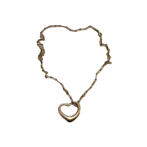 88B - TIFFANY & CO., A STERLING SILVER HEART PENDANT BY ELSA PERETTI, TOGETHER WITH A SILVER CHAIN
Marked ... 