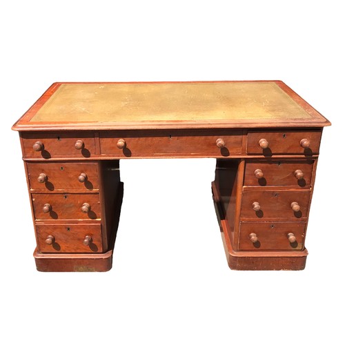 244 - A 19TH CENTURY VICTORIAN MAHOGANY PEDESTAL DESK
Green tooled leather top above nine drawers, raised ... 