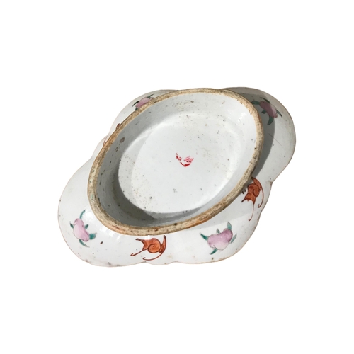 138 - A 19TH CENTURY CHINESE FAMILLE ROSE RAISED DISH
Decorated with flowers and foliage. 
(h 4.9cm x w 21... 