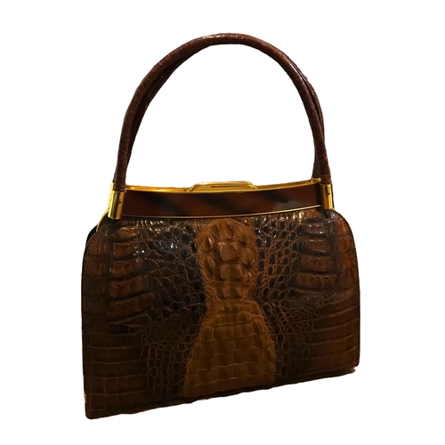 102 - TWO VINTAGE CROCODILE SKIN HANDBAGS.
(largest h 36cm x w 25cm x depth 7cm)