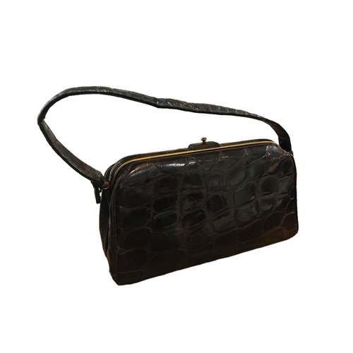 104 - TWO VINTAGE CROCODILE SKIN HANDBAGS.
(largest h 23.5cm x w 23cm x depth 7cm)