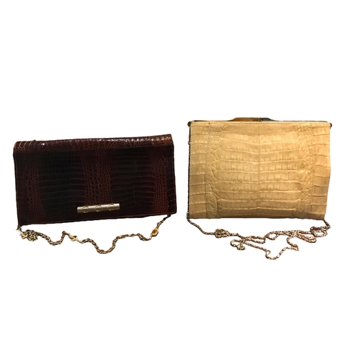 115 - TWO VINTAGE CROCODILE SKIN CLUTCH BAGS.
(largest h 17cm x w 21.5cm x depth 4cm)