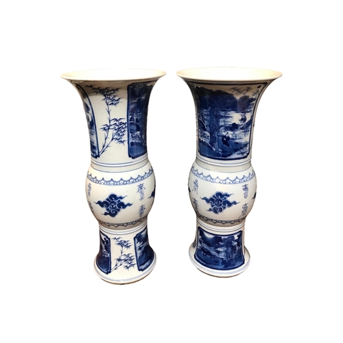 122 - A PAIR OF CHINESE BLUE AND WHITE GU BEAKER FORM VASES
Decorated with calligraphy in between landscap... 