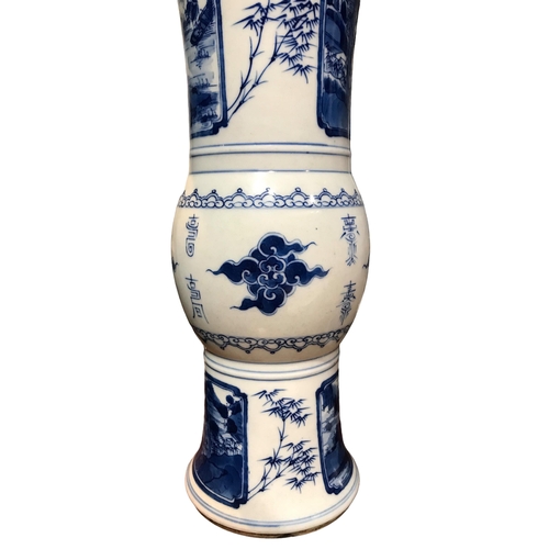 122 - A PAIR OF CHINESE BLUE AND WHITE GU BEAKER FORM VASES
Decorated with calligraphy in between landscap... 