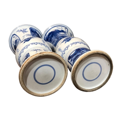 122 - A PAIR OF CHINESE BLUE AND WHITE GU BEAKER FORM VASES
Decorated with calligraphy in between landscap... 