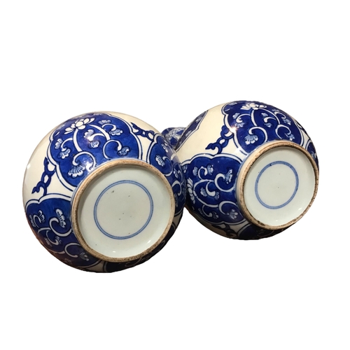 123 - A PAIR OF CHINESE BLUE AND WHITE SUANTOUPING GARLIC MOUTH SHAPED VASES
Decorated with geometric flor... 