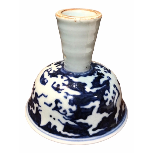 129 - A CHINESE BLUE AND WHITE STEM CUP 
Decorated with two dragons amongst clouds. 
(h 8.9cm x diameter 9... 