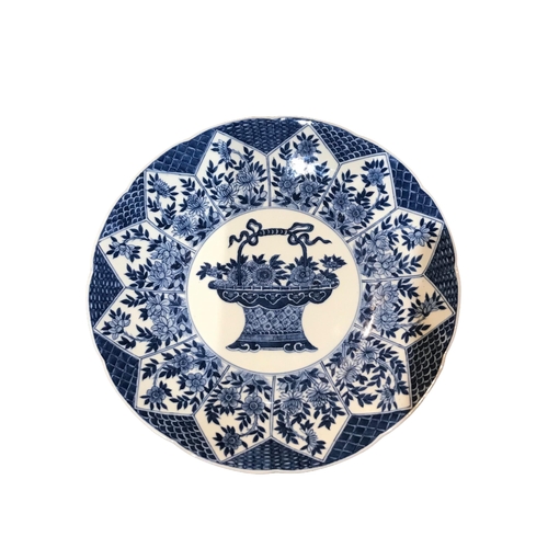 133 - A CHINESE BLUE AND WHITE PLATE 
Decorated with a central flower basket surrounded by geometric flora... 