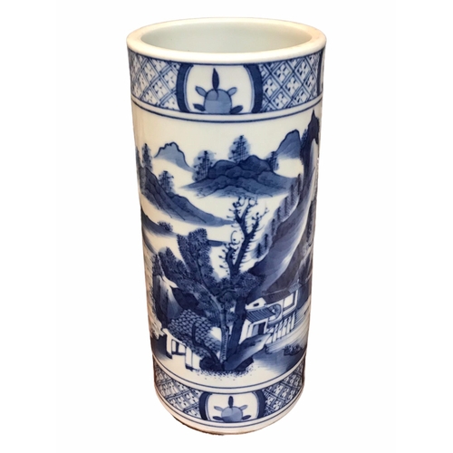 135 - A CHINESE BLUE AND WHITE BRUSH POT 
Decorated with a landscape scene with figure in a boat, met by b... 