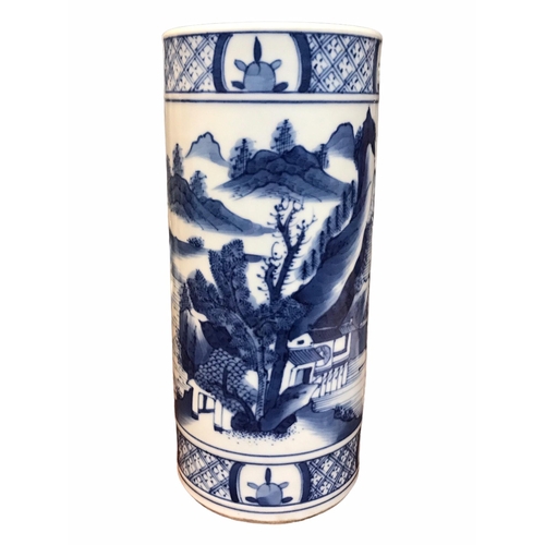 135 - A CHINESE BLUE AND WHITE BRUSH POT 
Decorated with a landscape scene with figure in a boat, met by b... 