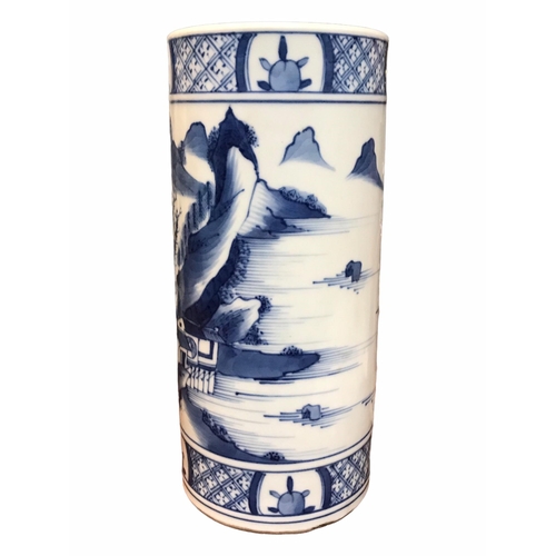 135 - A CHINESE BLUE AND WHITE BRUSH POT 
Decorated with a landscape scene with figure in a boat, met by b... 