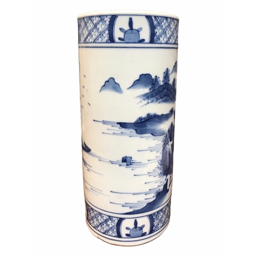 135 - A CHINESE BLUE AND WHITE BRUSH POT 
Decorated with a landscape scene with figure in a boat, met by b... 