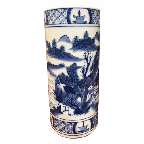 135 - A CHINESE BLUE AND WHITE BRUSH POT 
Decorated with a landscape scene with figure in a boat, met by b... 