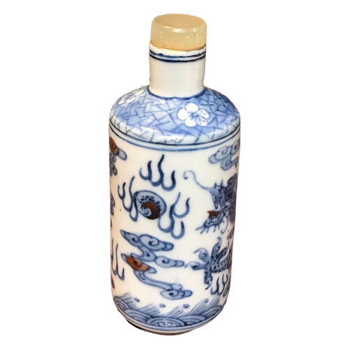 136 - A CHINESE BLUE AND WHITE PORCELAIN CYLINDRICAL SCENT BOTTLE 
Having a jade top stopper, decorated wi... 