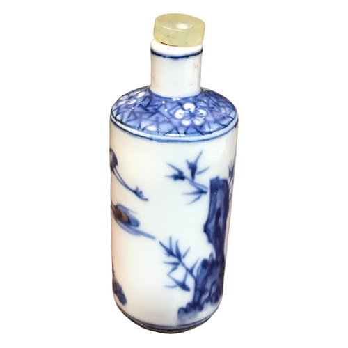 137 - A CHINESE BLUE AND WHITE PORCELAIN CYLINDRICAL SCENT BOTTLE
Having a jade top stopper, decorated wit... 