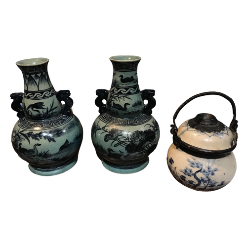 142 - A PAIR OF CHINESE MING STYLE VASES TOGETHER WITH A BLUE AND WHITE OPIUM POT VASES
Decorated with duc... 