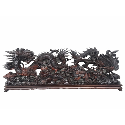 145 - A LARGE CHINESE CARVED HARDWOOD DEPICTING A DRAGON, PEACOCK, FO DOG AND
LÓNGGUĪ DRAGON TORTOISE.
(h ... 