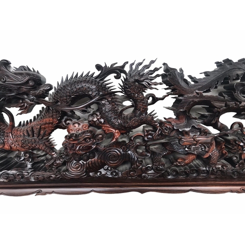 145 - A LARGE CHINESE CARVED HARDWOOD DEPICTING A DRAGON, PEACOCK, FO DOG AND
LÓNGGUĪ DRAGON TORTOISE.
(h ... 