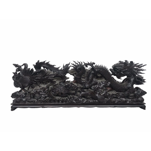 145 - A LARGE CHINESE CARVED HARDWOOD DEPICTING A DRAGON, PEACOCK, FO DOG AND
LÓNGGUĪ DRAGON TORTOISE.
(h ... 