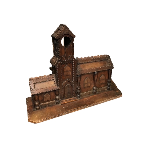 174 - AN LARGE 19TH CENTURY TRAMP ART CARVED WOOD TOWN HALL COIN BANK
Having three coin slots to back and ... 