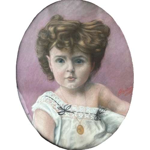 261 - A 20TH CENTURY OVAL PASTEL PORTRAIT OF A YOUNG GIRL
Indistinctly signed lower right, held in a decor... 