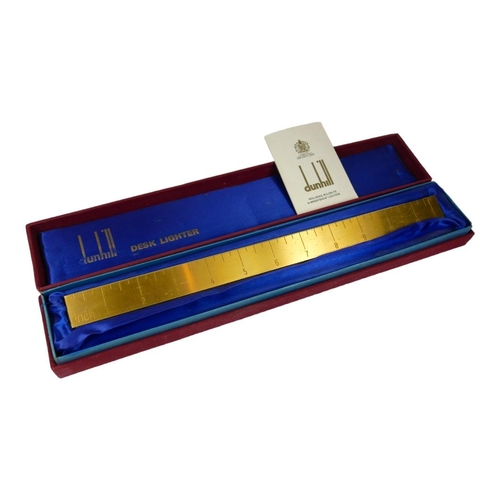 78 - DUNHILL, FOOT RULE, A VINTAGE GOLD PLATED DESK CIGARETTE LIGHTER
Number ‘US RE24163’, in a fitted sa... 