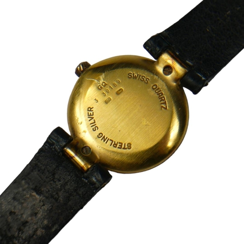 83 - DUNHILL, A SILVER GILT WRISTWATCH 
The circular gold tone dial with Roman number markings, on origin... 