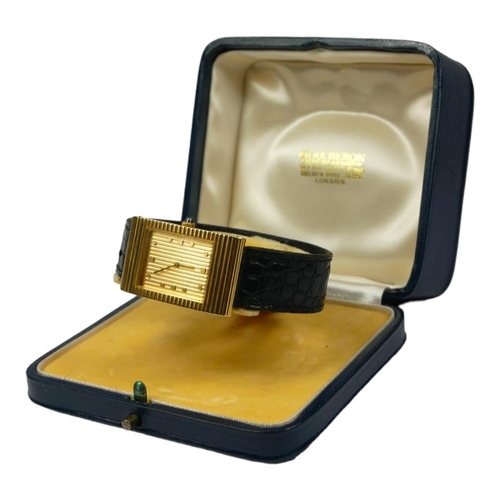 85 - BOUCHERON, A VINTAGE 18CT GOLD DRESS WATCH
The rectangular with horizontal lines to case, textured d... 