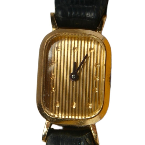 86 - BOUCHERON, A VINTAGE 18CT GOLD LADIES’ COCKTAIL WATCH
The rectangular form with gold tone textured d... 