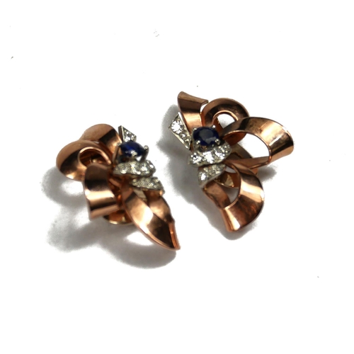 91 - A PAIR OF VINTAGE YELLOW METAL, DIAMOND AND SAPPHIRE EARRINGS
Ribbon form, with single round cut sap... 