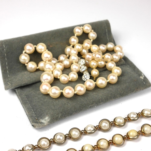 98 - A VINTAGE WHITE METAL AND DIAMOND PEARL NECKLACE
The single row of graduated pearls with bow form cl... 